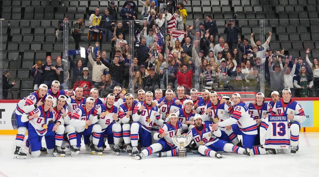USA Hockey, featuring Vancouver Canucks forwards Conor Garland and Drew O'Connor, celebrate their 2025 IIHF World Championship victory.